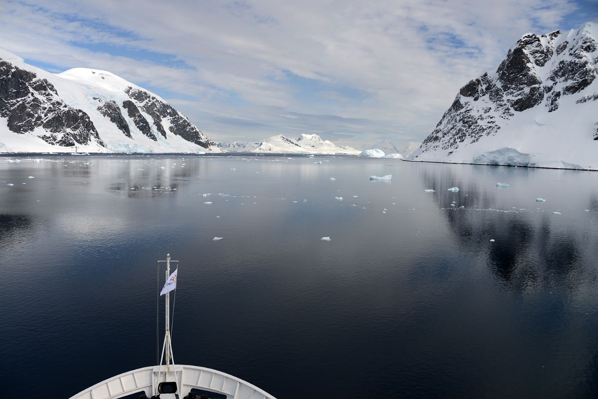 01B Sailing Between Van Beneden Cap And Ronge Island With Lemaire Island Ahead On The Way To Almirante Brown Station From Quark Expeditions Antarctica Cruise Ship